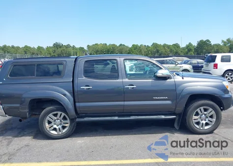 2015 Toyota Tacoma Base V6 z USA, uszkodzony, nr VIN 3TMLU4EN1FM177255